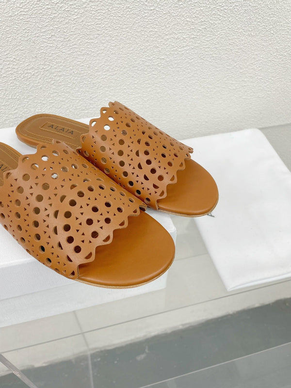 MULES PIATTE ALAIA VIENNE IN PELLE DI AGNELLO MARRONE CIOCCOLATO