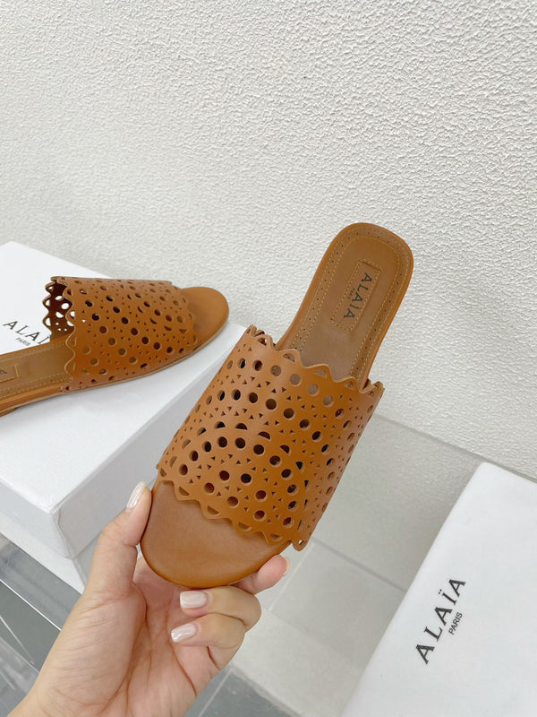 MULES PIATTE ALAIA VIENNE IN PELLE DI AGNELLO MARRONE CIOCCOLATO