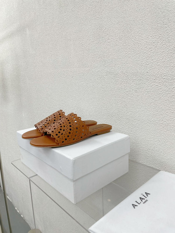 MULES PIATTE ALAIA VIENNE IN PELLE DI AGNELLO MARRONE CIOCCOLATO