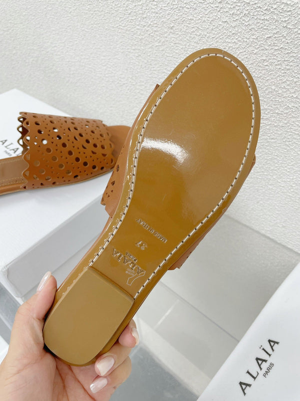 MULES PIATTE ALAIA VIENNE IN PELLE DI AGNELLO MARRONE CIOCCOLATO