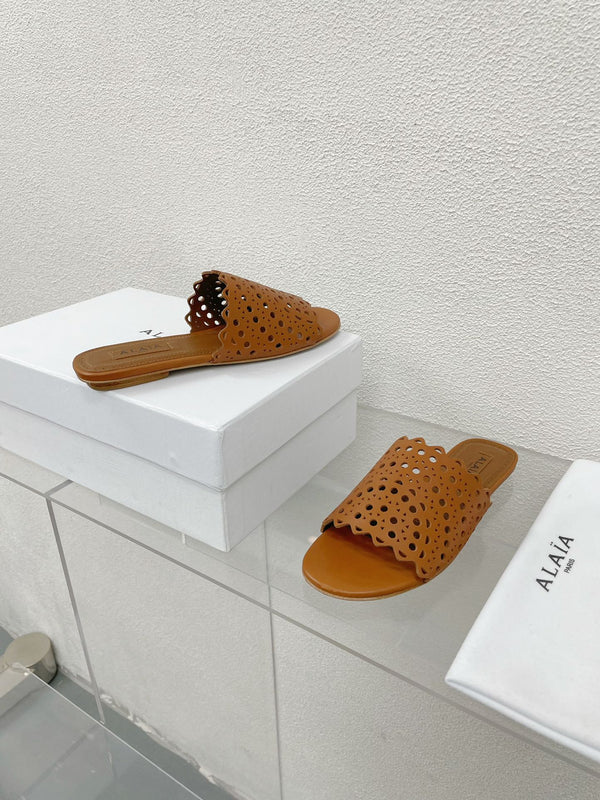 MULES PIATTE ALAIA VIENNE IN PELLE DI AGNELLO MARRONE CIOCCOLATO