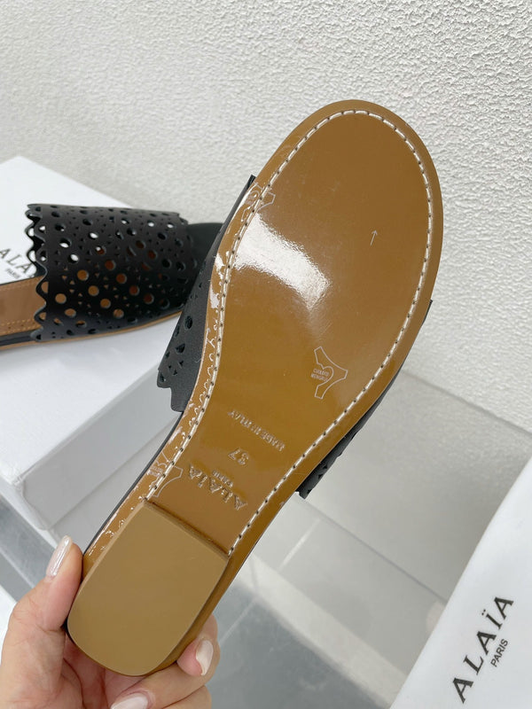 MULES FLAT ALAIA VIENNE IN AGNELLO NERO