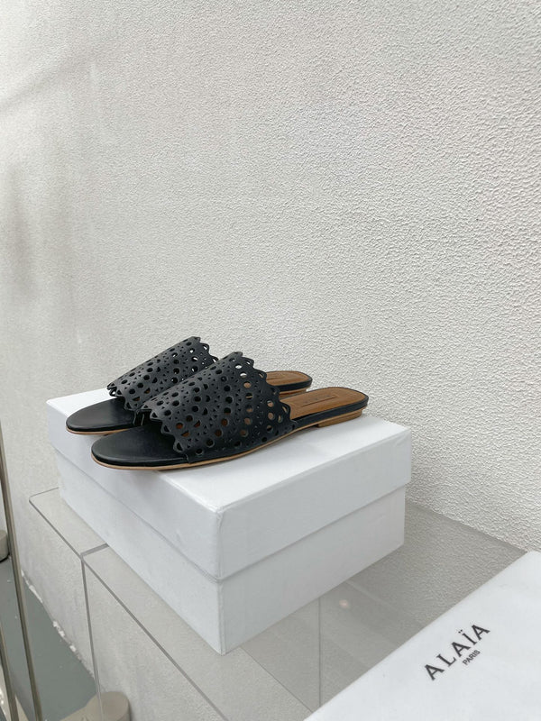 MULES FLAT ALAIA VIENNE IN AGNELLO NERO