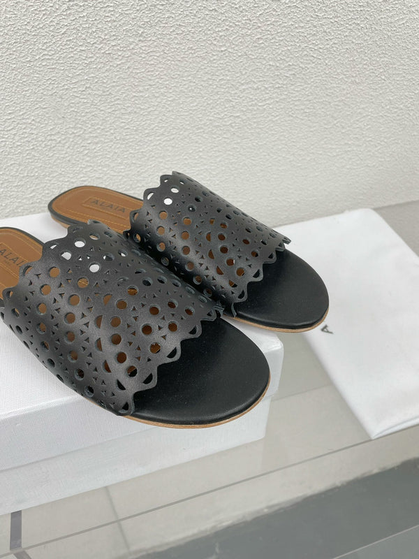 MULES FLAT ALAIA VIENNE IN AGNELLO NERO