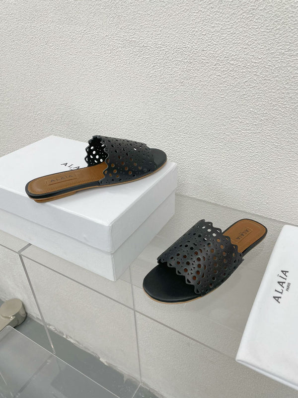 MULES FLAT ALAIA VIENNE IN AGNELLO NERO