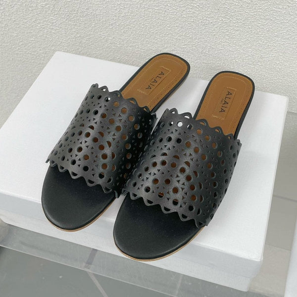 MULES FLAT ALAIA VIENNE IN AGNELLO NERO
