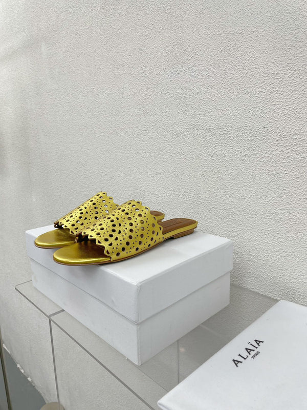 MULES PIATTI ALAIA VIENNE IN AGNELLO DORATO