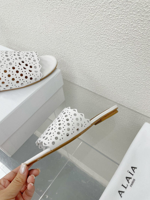 MULES FLAT ALAIA VIENNE IN AGNELLO BIANCO