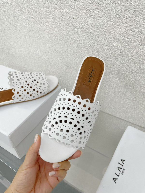 MULES FLAT ALAIA VIENNE IN AGNELLO BIANCO