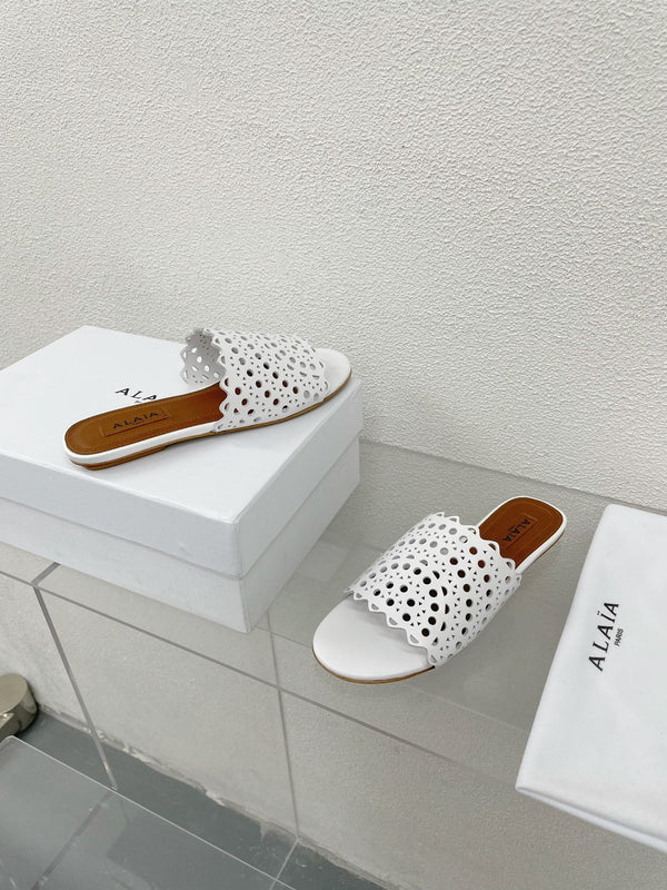 MULES FLAT ALAIA VIENNE IN AGNELLO BIANCO