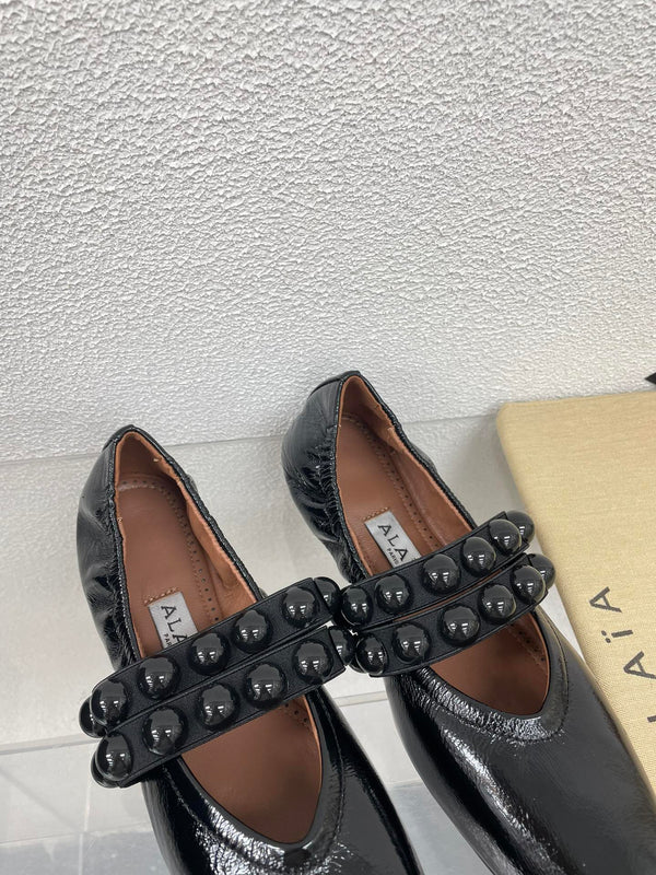 ALAIA MARY JANE PEARL IN GLOSSY BLACK LAMBSKIN