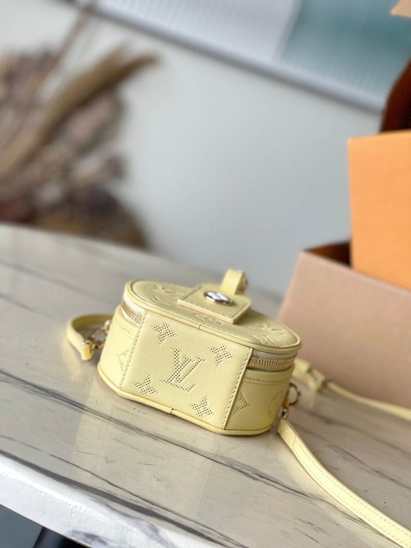 MINI CAPPELLIERA SCATOLA 13 IN PELLE DI VITELLO TRAFORATA CON MONOGRAMMA GIALLO BANANA