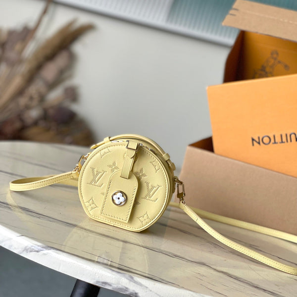 MINI CAPPELLIERA SCATOLA 13 IN PELLE DI VITELLO TRAFORATA CON MONOGRAMMA GIALLO BANANA