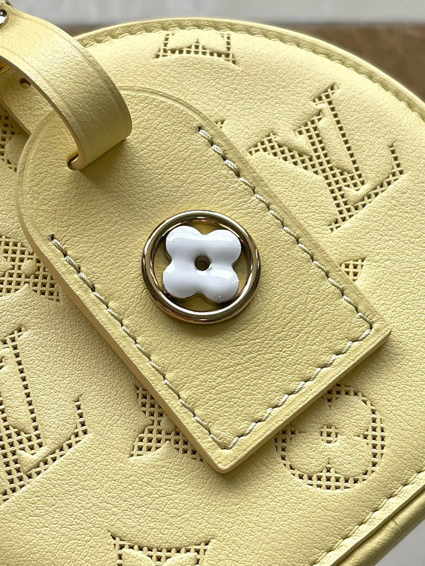 MINI CAPPELLIERA SCATOLA 13 IN PELLE DI VITELLO TRAFORATA CON MONOGRAMMA GIALLO BANANA