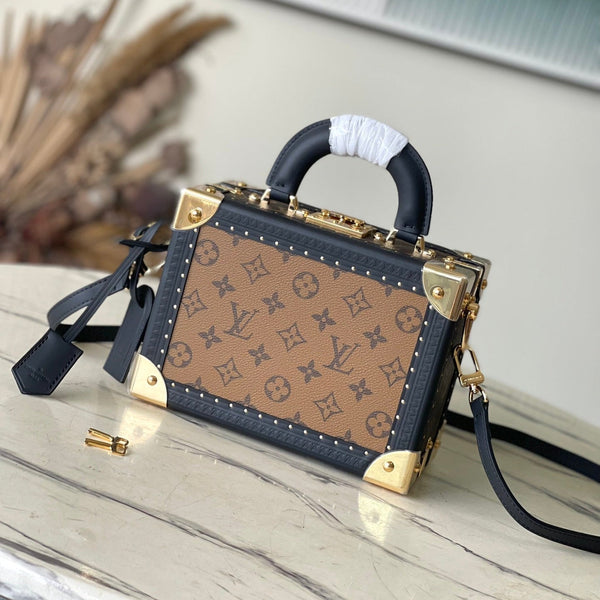 VALIGIA PICCOLA 22 IN TELA RETROMARINA CON MONOGRAMMA E BORDI IN PELLE DI VITELLO NERA, FERRAMENTA ORO