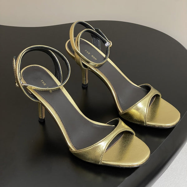 Sandali con tacco alto e cinturino The Row 25S 85 mm in pelle di vacchetta metallizzata nera e oro 286193