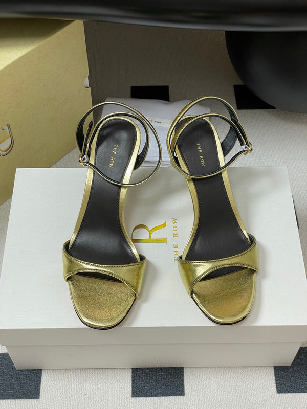 Sandali con tacco alto e cinturino The Row 25S 85 mm in pelle di vacchetta metallizzata nera e oro 286193