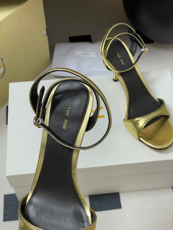 Sandali con tacco alto e cinturino The Row 25S 85 mm in pelle di vacchetta metallizzata nera e oro 286193