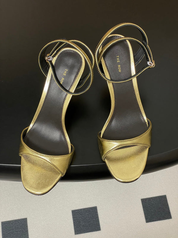 Sandali con tacco alto e cinturino The Row 25S 85 mm in pelle di vacchetta metallizzata nera e oro 286193