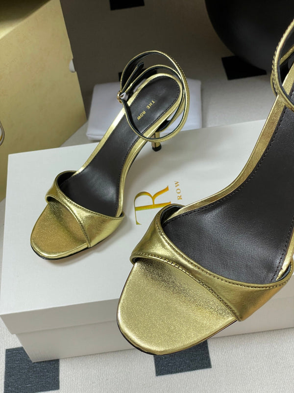 Sandali con tacco alto e cinturino The Row 25S 85 mm in pelle di vacchetta metallizzata nera e oro 286193