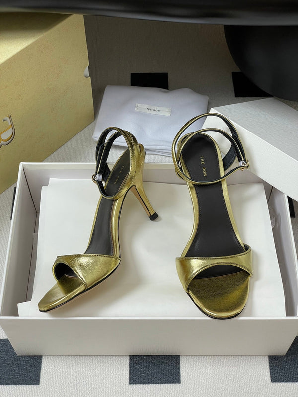 Sandali con tacco alto e cinturino The Row 25S 85 mm in pelle di vacchetta metallizzata nera e oro 286193