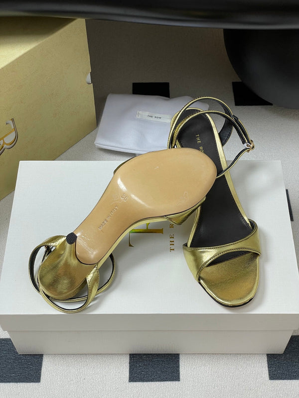 Sandali con tacco alto e cinturino The Row 25S 85 mm in pelle di vacchetta metallizzata nera e oro 286193