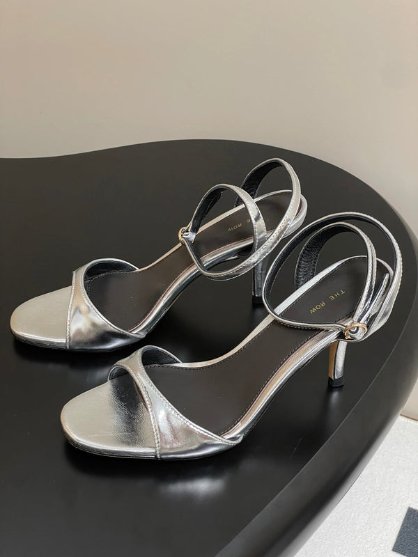 Sandali con tacco alto e cinturino The Row 25S 85 mm in pelle di vacchetta metallizzata nera e oro 286193