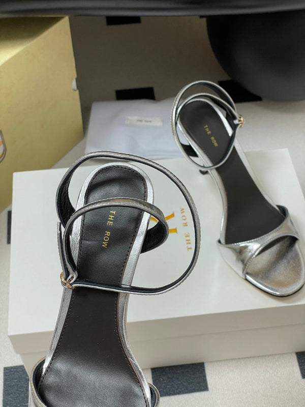 Sandali con tacco alto e cinturino The Row 25S 85 mm in pelle di vacchetta metallizzata nera e oro 286193