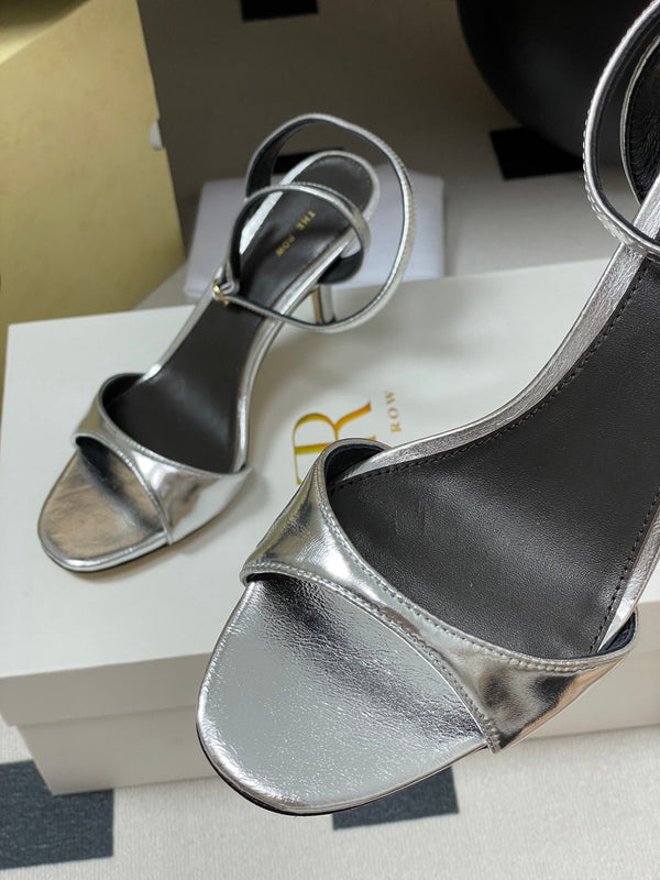 Sandali con tacco alto e cinturino The Row 25S 85 mm in pelle di vacchetta metallizzata nera e oro 286193