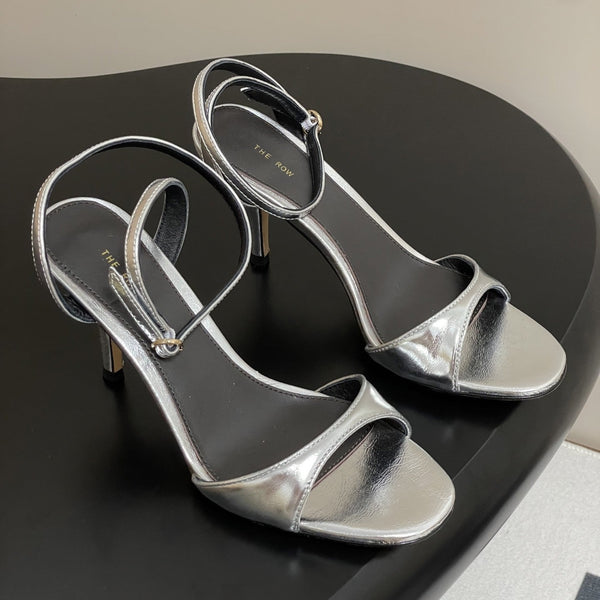 Sandali con tacco alto e cinturino The Row 25S 85 mm in pelle di vacchetta metallizzata nera e oro 286193