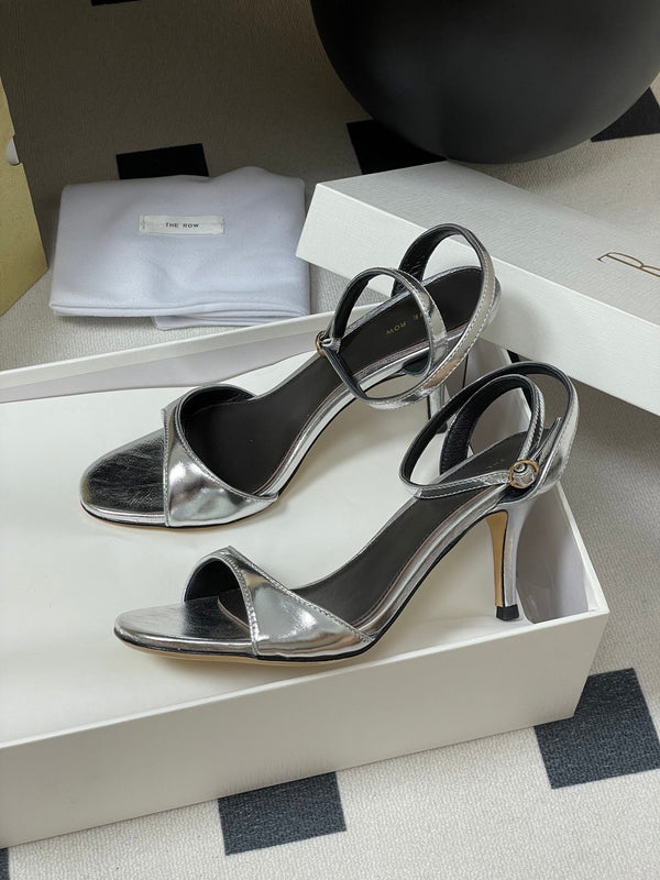 Sandali con tacco alto e cinturino The Row 25S 85 mm in pelle di vacchetta metallizzata nera e oro 286193