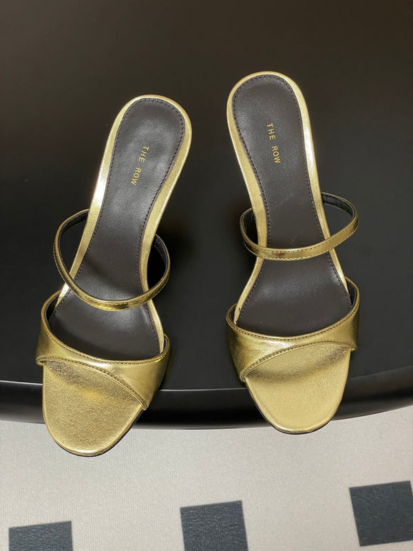 Sandali con tacco alto e cinturino The Row 25S, 85 mm, in pelle di vacchetta metallizzata nera e oro 286210