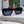 MONTAIGNE SUNGLASS 571596 IN BLACK ACETATE TEXT LOGO