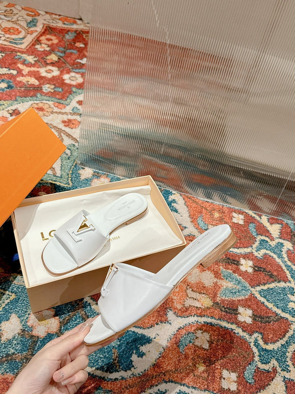 lv capri flat mule white calfskin