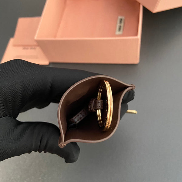 Ciondolo per borsa in pelle con chiave in vitello cioccolato 240337