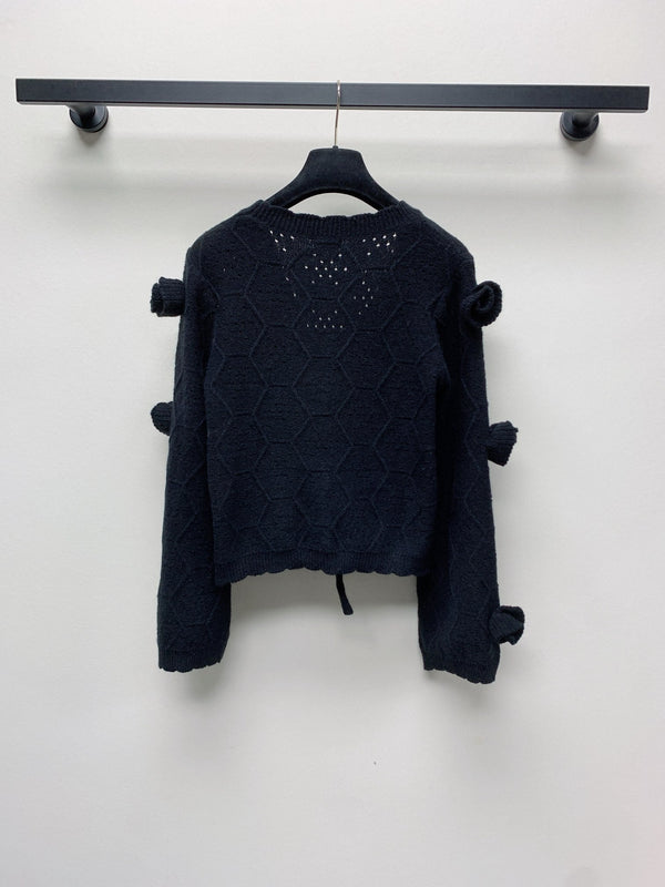 CC 25 Cardigan lavorato a maglia con motivo floreale tridimensionale in nero 277589