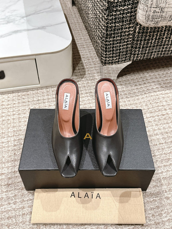 MULES GIOIELLO ALAIA SPIKE IN PELLE DI VITELLO NERA