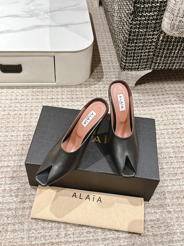 MULES GIOIELLO ALAIA SPIKE IN PELLE DI VITELLO NERA