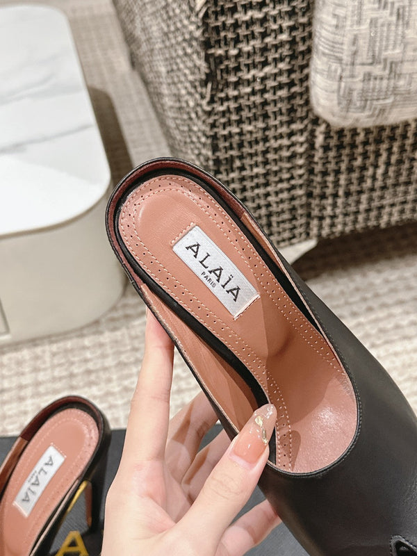 MULES GIOIELLO ALAIA SPIKE IN PELLE DI VITELLO NERA