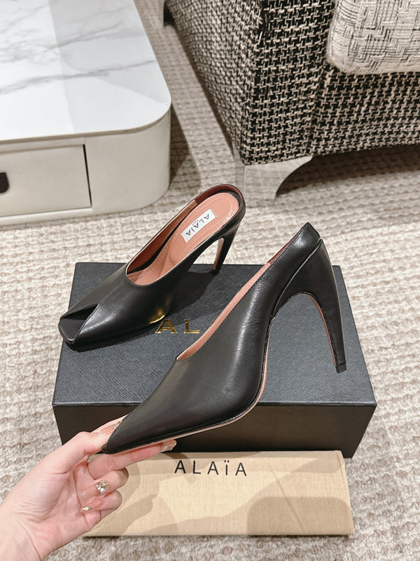 MULES GIOIELLO ALAIA SPIKE IN PELLE DI VITELLO NERA