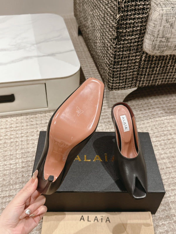 MULES GIOIELLO ALAIA SPIKE IN PELLE DI VITELLO NERA