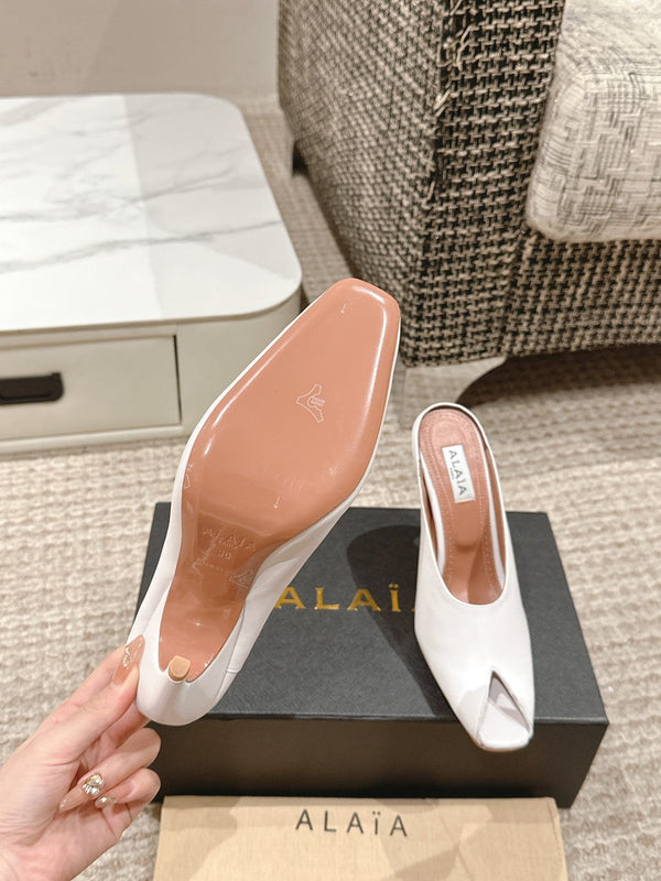 MULES GIOIELLO ALAIA SPIKE IN PELLE DI VITELLO BIANCA