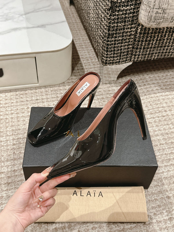 MULES GIOIELLO ALAIA SPIKE IN PELLE DI VITELLO NERA LUCIDA