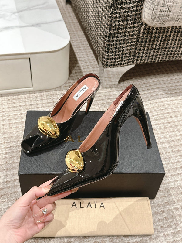 MULES GIOIELLO ALAIA SPIKE IN PELLE DI VITELLO NERA LUCIDA CON FERRAMENTA ORO