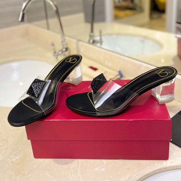 HIGH MULE 60MM IN BLACK SHEEPSKIN AND TRANSPARENT PVC