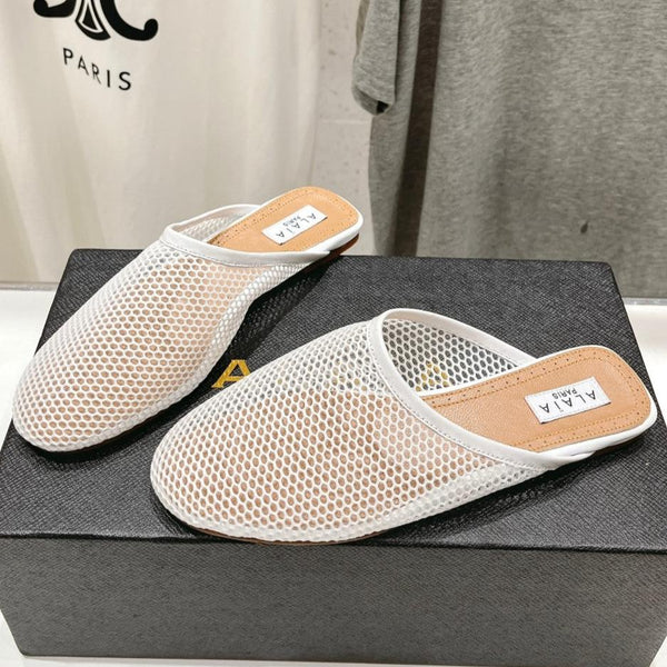 MULES ALAIA FLAT IN RETE BIANCA