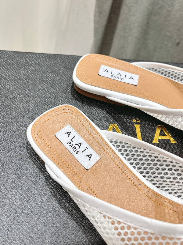 MULES ALAIA FLAT IN RETE BIANCA