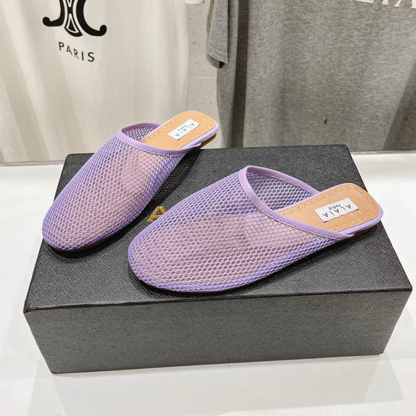 MULES PIATTI ALAIA IN RETE VIOLA CHIARO