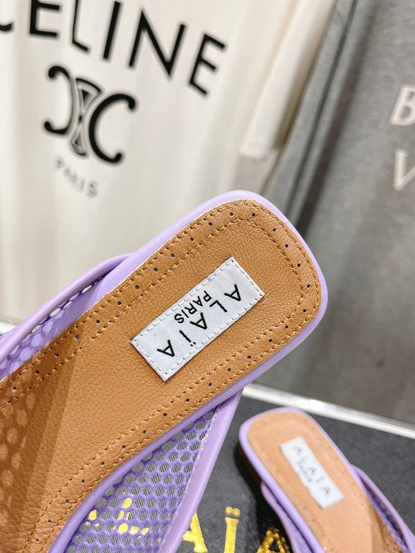MULES PIATTI ALAIA IN RETE VIOLA CHIARO