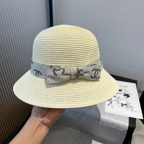 STRAW BUCKET HAT IN IVORY WITH RIBBON BOW 673977